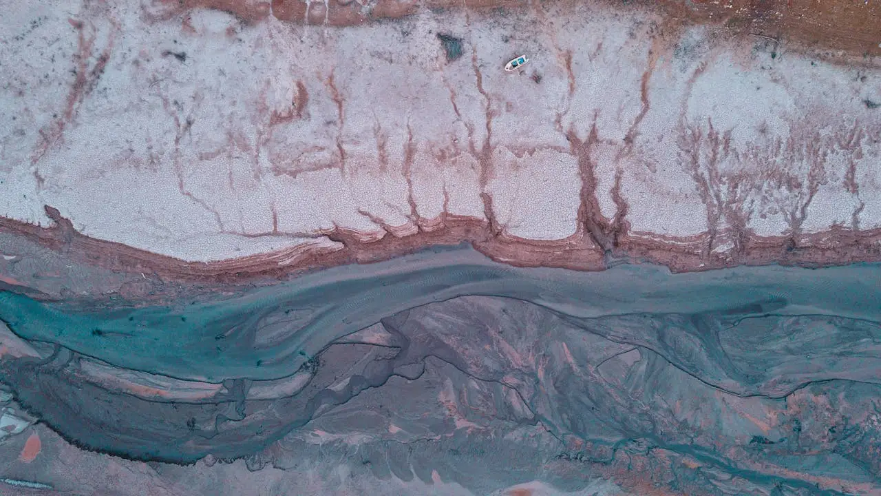 team-04 Aerial drone shot of an arid, barren terrain in Evrytania, Greece, showcasing a dry riverbed.