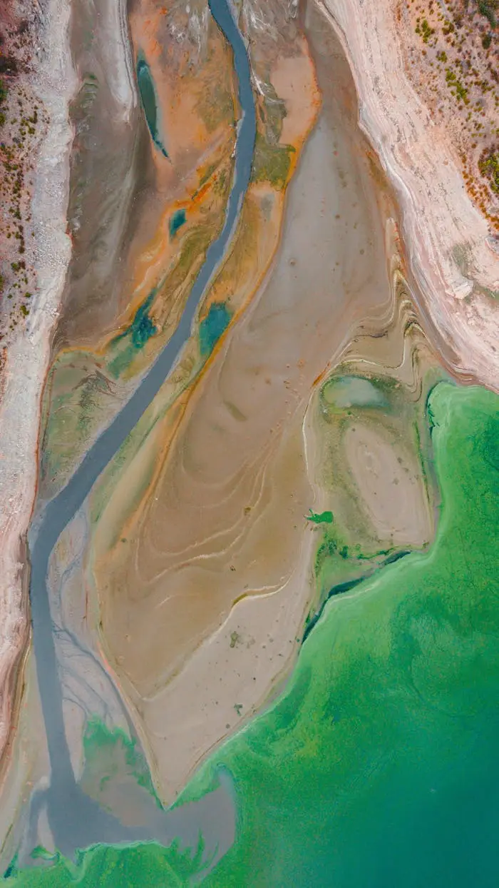 Dramatic aerial shot showcasing a dried riverbed with vibrant colors in Türkiye.